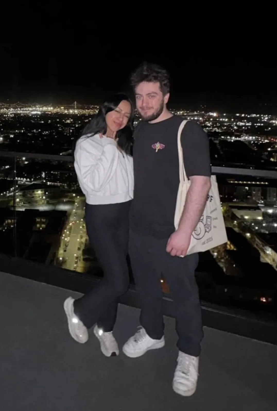 Michalis and Cristal on a San Francisco rooftop at night